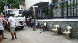 Free bags of rice handed out to residents struggling from Covid-19 downturn in the Philippines
