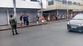 Teens caught breaking Philippines COVID-19 lockdown by playing basketball made to throw invisible hoops