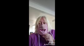 Woman can't stop laughing at DIY sock face mask