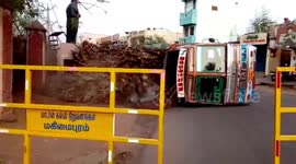 Driver escapes death, alights overloaded truck moments before it turns turtle in southern India