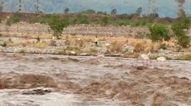Officials rescue man stuck in rising waterbody in northern India