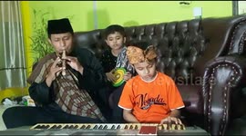 Spending time during the pandemic covid-19, children and fathers collaborate to play instrumental music at home