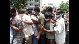 Women activists in India take to the streets in protest against reopening of wine shops.