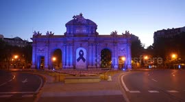 Black ribbon displayed at Puerta de Alcalá in Madrid to mourn the more than 25.000 coronavirus victims in Spain
