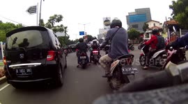 Social distancing? Just another day of tightly packed traffic in Jakarta