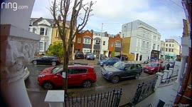 Bizarre moment delivery driver SPITS on railings and lamp posts in London
