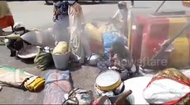 Migrant workers sprayed with disinfectants in a bid to sanitize them of Coronavirus after they arrived in Lucknow, Uttar Pradesh