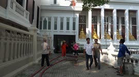 Buddhist monks tackle fire at temple in Thailand