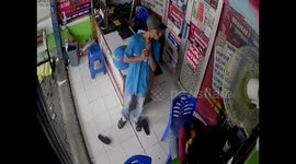 Security camera captures moment alleged thief steals sleeping man's phones