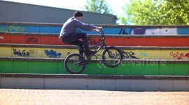 Cool colorful Wheelie Balance Trick with BMX Bike