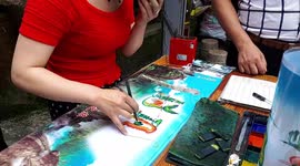 Chinese girl making art at the top of Sanqingshan (Mount Sanqing)