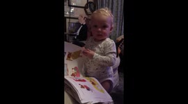 Baby/toddler reads the paper - imitates Grandfather