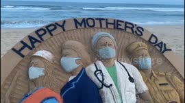 Indian sand artist creates coronavirus Mother's Day sculpture