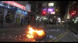 Hong Kong protesters light fire in Mong Kok during Mother's Day protests