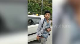 Police officials intercept people without facemasks, furnish them with one in northeast India