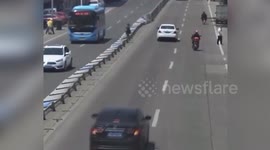Central reservation falls like dominos after alleged drunk man pushes them down to cross road in China