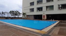 Tropical storm rattles the water in swimming pool in Bangkok