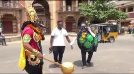 Indian Police dress as death god and coronavirus in public street theatre