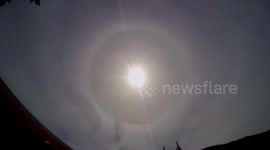 Complete ring, full 22° solar halo spotted in swiss Alps