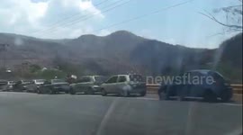 Venezuelans queue for miles at petrol stations during COVID-19 pandemic