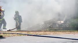 Firefighters in Northwest Florida battle another building in flames during red flag warning