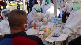 Indonesian health workers conduct 'rapid mass tests' on market traders