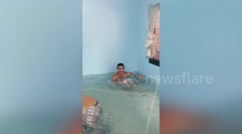 Family turn empty room into swimming pool during heatwave in the Philippines