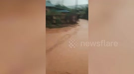 Dozens of homes damaged by muddy torrents during flash floods in northern Thailand