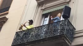 Saxophone player entertains neighbours in France as fireman dance on cherry picker next to his balcony