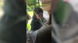 Indiana teacher uses plastic covering to hug students amid coronavirus outbreak