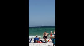 Sudden shark attack filmed on Florida beach