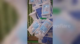 'Anti-theft' pins spotted nailed into face masks in Chinese supermarket
