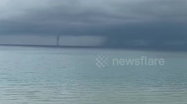 Rare double waterspout forming over the sea amazes locals in southern Thailand