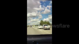 Reportedly distracted truck driver hits a car on California highway