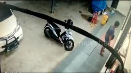 Man caught on security camera steals a motorbike in Indonesia