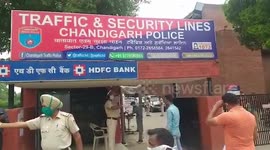 Cops come up with novel approach of using thermal gun while maintaining social distancing in northern India