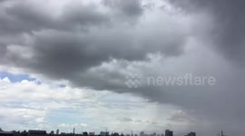 Dark grey clouds form in Manila as Typhoon Ambo hits the Philippines