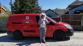 Postman in fancy dress delivers post to pensioners
