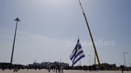 'Largest Greek flag ever' hoisted into position with crane near Turkey border