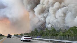 Helicopters drop water on wildfire along I-75 in Florida
