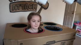 Mom and dad spend two days building Whack-a-Mole game using kids as moles - and it even comes with sound effects!