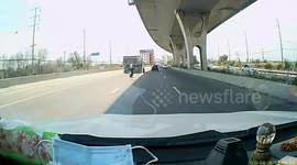 Two wheels come loose from truck on motorway in Bangkok