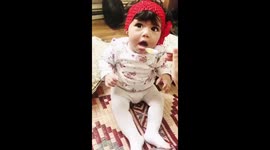 Baby trying tangy passion fruit