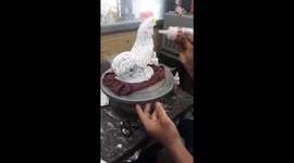 Vietnamese baker makes big rooster from cream