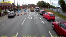 Man 'pushed' from moving car in UK after cutting across truck and racing through closed lane
