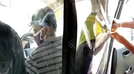 Cab driver creates 'plastic shield' to socially distance in southern India