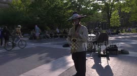 Crowds Flock to Washington Square Park on the First Summer-Like Day of the Year