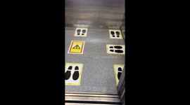 Floor stickers used to regulate social distancing in Japanese elevators