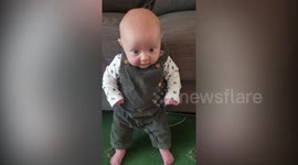 ‘World’s strongest baby’ stands on her own at just eight weeks of age