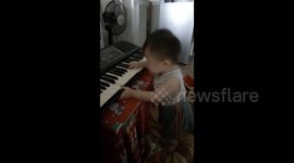 Toddler demonstrates organ music instrument playing like an expert!